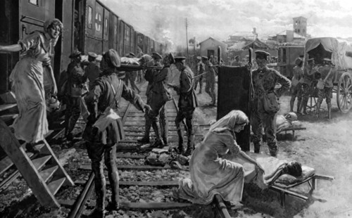 An WWI ambulance train stops at a field hospital in France
