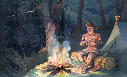 President Theodore Roosevelt wearing buckskin and raccoon hat, sitting by a campfire at night