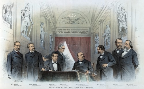 President Cleveland sitting at a desk between his cabinet members