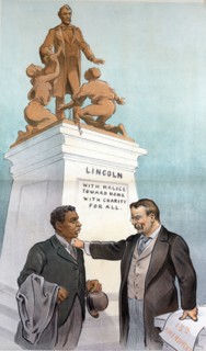 President Theodore Roosevelt, standing with right hand on the left shoulder of an African American man
