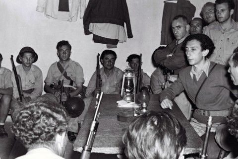Photograph of Kibbutz members at a military briefing at Yad Mordechai