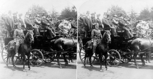President McKinley and others in a horse-drawn carriage.