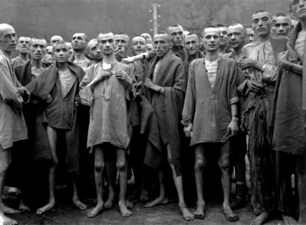 Male prisoners celebrating their survival in a concentration camp.