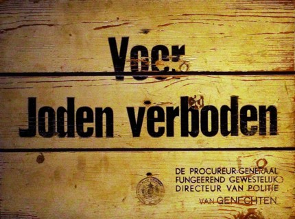A sign saying 'Forbidden for Jews' issued by the Director of Police