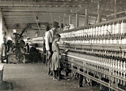 Photograph of Young girl working as a spinner