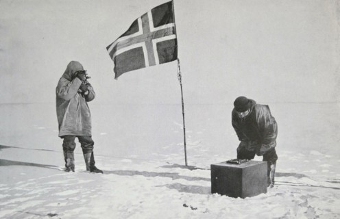 Captain Roald Amundsen taking sights at the South Pole.