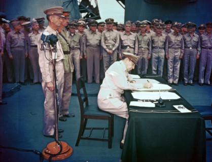 General Douglas MacArthur signing the Instrument of Surrender on behalf of the Allied Powers 1945