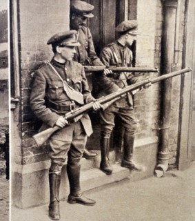 Photograph of armed soldiers guarding the four court after the battle of the four courts
