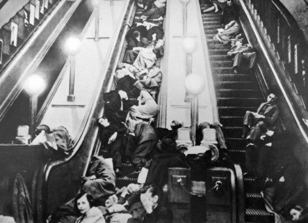 London underground escalators packed with people sheltering from an air raid in world war two 1941