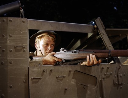 Colour photograph of an infantryman with a Garand rifle