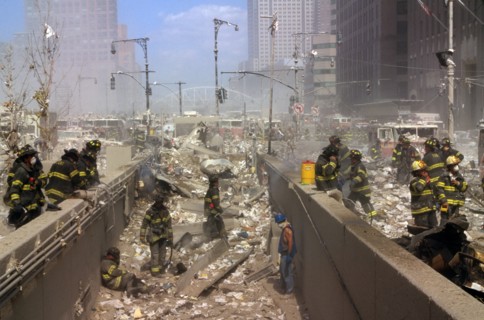 Colour photograph of New York Firefighters amid the rubble of the World Trade Centre following the 9/11 attacks