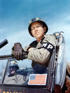 Colour photograph of a Military police officer of the US Army 1944