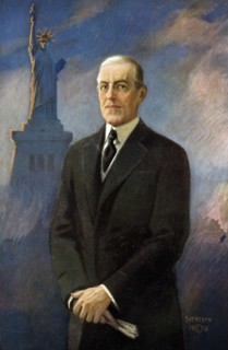 Woodrow Wilson with Statue of Liberty in background.