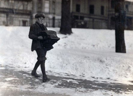 Boy delivering a typewriter