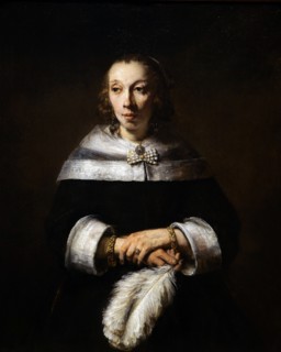 Painting titled 'Portrait of a Lady with an Ostrich-Feather Fan' by Rembrandt
