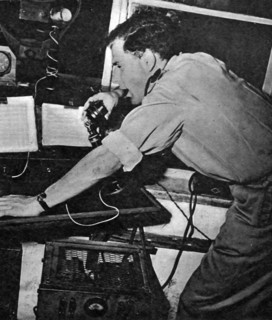 Photograph of a technician aiding aircrafts over the radio at Lydda Airport