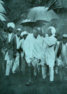 Mahatma Gandhi walks to a protest in the monsoon rain 1935