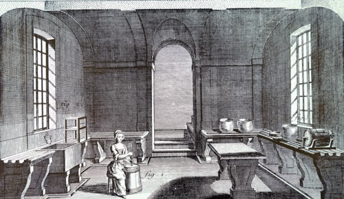 A dairy and dairymaid using a barrel churn