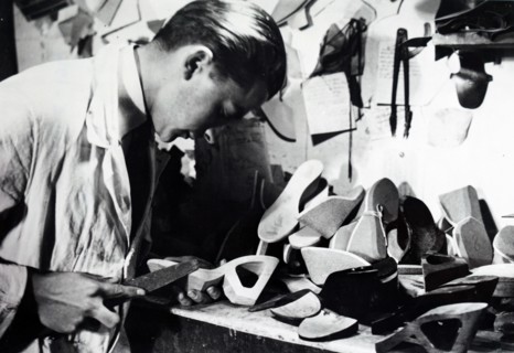 Photograph of a cobbler preparing heels for women's shoes during the German occupation of France 1941