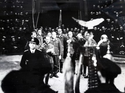 Photograph of Nazi soldiers singing at the start of a circus in Paris, during the German occupation of France, in World War Two