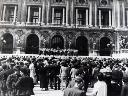 Photograph of Nazi soldiers singing in front of a Church in Paris, during the German occupation of France, in World War Two