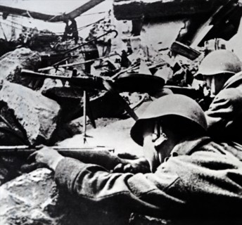 Photograph of Soviet Red Army soldiers during a street battle during the Siege of Berlin which helped bring on the German surrender in World War Two 1945