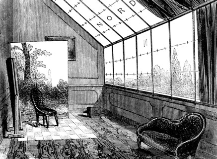 A small photographer's studio, showing a backdrop, and mirror to reflect light on to the subject
