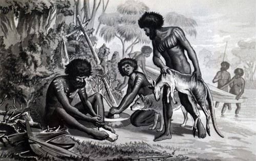 Australian aborigines preparing a meal using a bow drill a prehistoric form of drilling tool, which was used to produce fire
