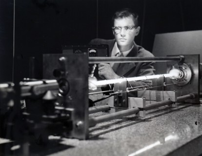 Photograph of a LASER FOR SPACE — Gas-filled electronic device whose first job will be to greatly sharpen the accuracy of a new space tracking radar is fired up by an engineer at Sperry Rand's Electro...