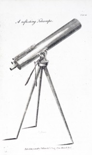 A small reflecting telescope mounted on a tripod