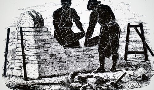 Two labourers building a dry stone wall somewhere in the English countryside