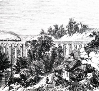 A train crossing viaduct near a remote farmstead