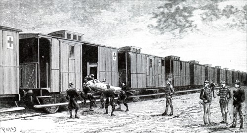 A stretcher case being brought on board a French military hospital train