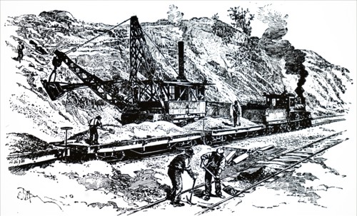 A steam excavator working on a railway embankment