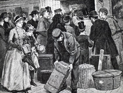 A railway porter trying to help a passenger find her luggage