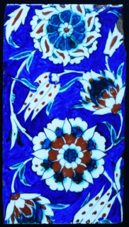 Iznik ceramic tile decorated with vines, grapes and flowers