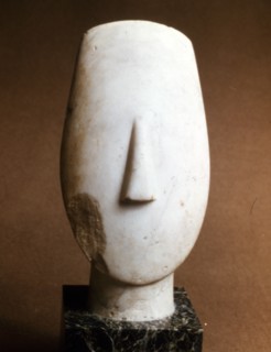 Head of a female, Cycladic statue of the "idol with crossed arms" type