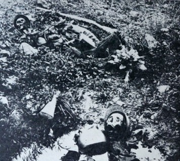 The remains of two French soldiers lie in a shell crater at Verdum during World War I