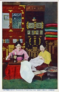 Korean seamstress making clothes for sale in her shop
