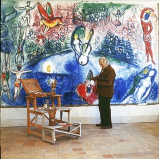 Painter Marc Chagall and his painting >Commedia dell`Arte< Photograph. 1959.
