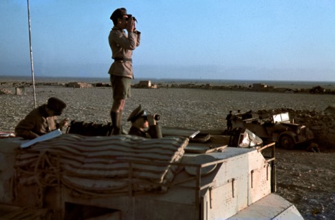 Field Marshal Erwin Rommel watching battlefield 1941 Tunisia in Captured British armoured truck MAX. MAMMUT