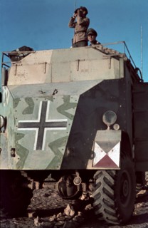 Field Marshal Erwin Rommel watching battlefield 1941 Tunisia in Captured British armoured truck MAX. MAMMUT