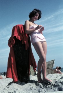 A woman in a bathing suit at the beach