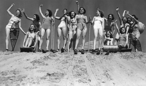 Women go skiing on a beach