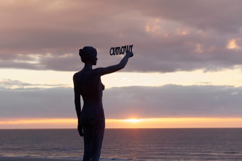 Woman writes French word Amour