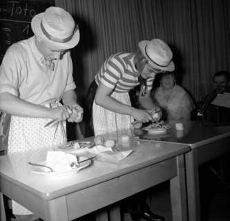 Women peeling and preparing potatoes