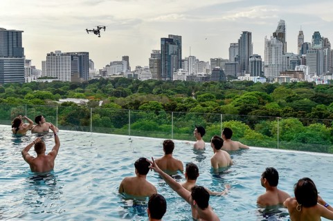 DJI Inspire 1 drone flies over Swimminpgool
