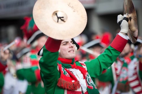 Musician of a brass band with cymbals in uniform