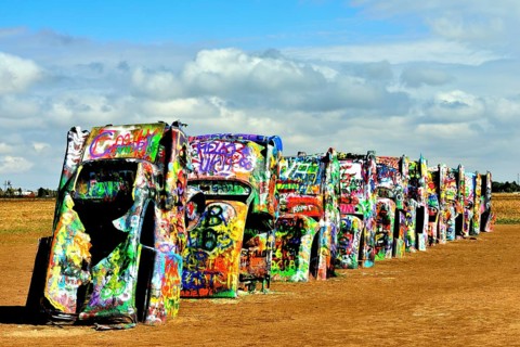 Painted Cadillacs rammed into the ground