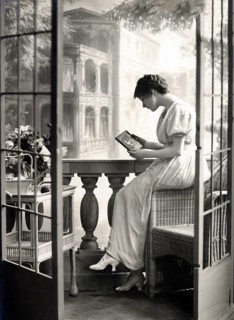 Woman longingly holding a picture of her man